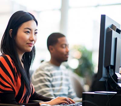 people sitting in front of monitors